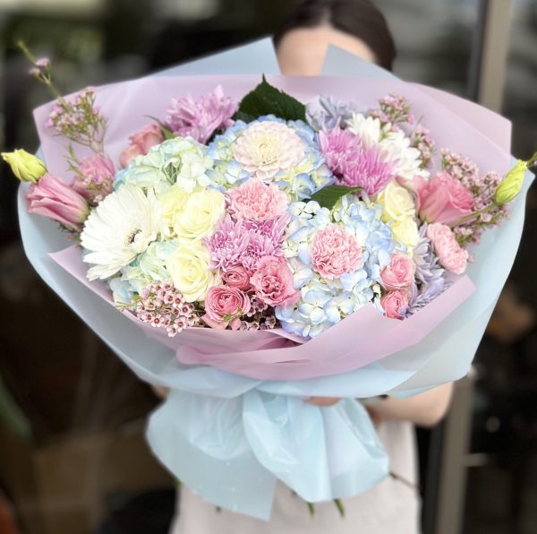 Petals of Paradise bouquet featuring vibrant and colorful flowers in a stunning arrangement.