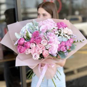 Bouquet 'Petal Perfection' featuring a stunning array of fresh blooms against a neutral background.