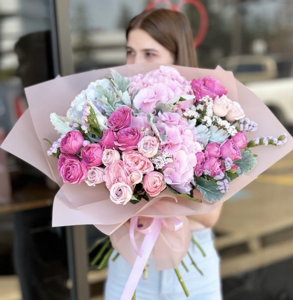 Bouquet 'Petal Perfection' featuring a stunning array of fresh blooms against a neutral background.