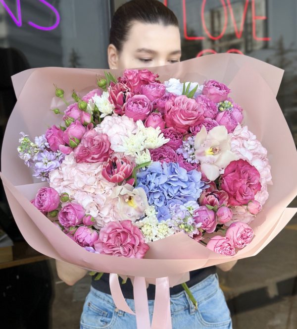 Charming bouquet of delicate blooms in the 'Blossom Song' arrangement, showcasing elegance and springtime beauty.