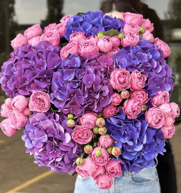 Striking bouquet of purple and violet blooms in the 'Violet Explosion' arrangement, adding dramatic flair and elegance.