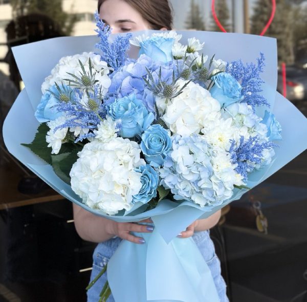 Elegant bouquet 'Moonlit Harmony' featuring white and silvery blooms, arranged to evoke the serene beauty of a moonlit night.