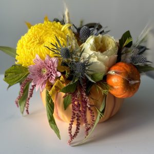 Autumn flower arrangement featuring rich seasonal blooms in warm colors, perfect for Thanksgiving decor.