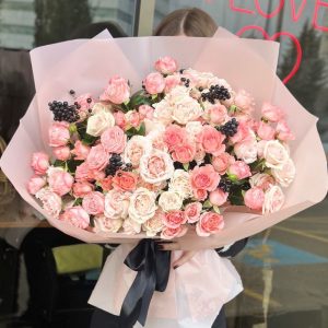 A beautiful bouquet titled "Sweet Fragrance," featuring mixed spray roses elegantly arranged and wrapped in pastel pink paper.