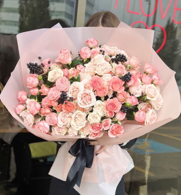 A beautiful bouquet titled "Sweet Fragrance," featuring mixed spray roses elegantly arranged and wrapped in pastel pink paper.