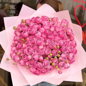 A stunning bouquet titled "Pink Blossom Bliss," featuring lush peony roses in bright pink shades, elegantly arranged and wrapped in soft pink packaging.