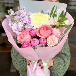 A charming bouquet titled "Tender Touches," featuring soft pastel roses, delicate peony roses, and sweet chrysanthemums.