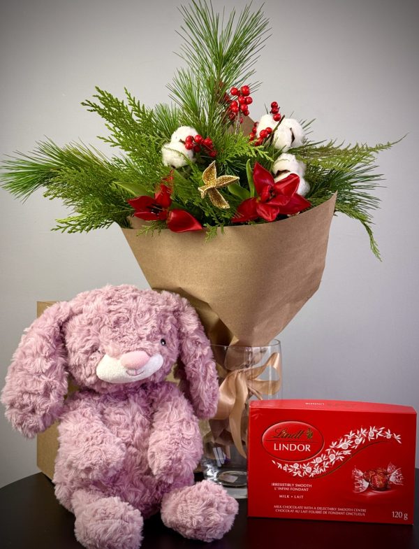 Christmas gift set with a red tulip and ilex arrangement, a festive toy, and candies, perfect for holiday gifting.