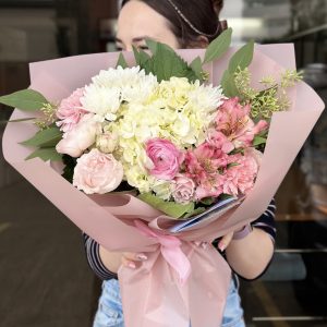 "Pink Florist's Choice" bouquet featuring a variety of pink flowers arranged thoughtfully for a fresh and vibrant look.