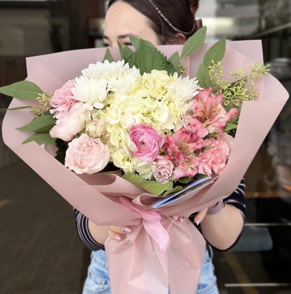 "Pink Florist's Choice" bouquet featuring a variety of pink flowers arranged thoughtfully for a fresh and vibrant look.