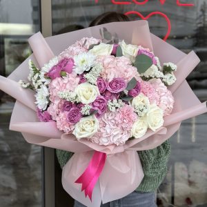 "Love Whisper" bouquet featuring soft, romantic flowers, designed to convey love and warmth for special moments and heartfelt gestures.