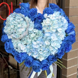 "Heartfelt Moments" bouquet with blue roses, hydrangea, and diadema, a sophisticated and elegant floral arrangement perfect for meaningful occasions.