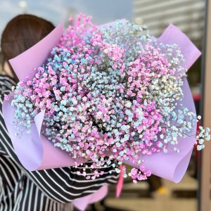 Angel’s Touch bouquet with soft pastel flowers and white gypsophila, arranged in a romantic floral design.