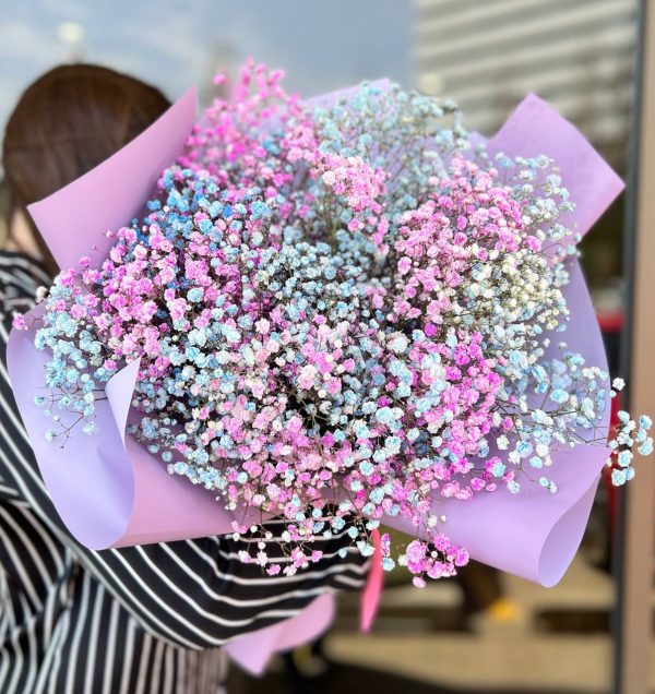 Angel’s Touch bouquet with soft pastel flowers and white gypsophila, arranged in a romantic floral design.