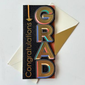 Graduation card with elegant design placed alongside a bouquet, ready for a personal message.