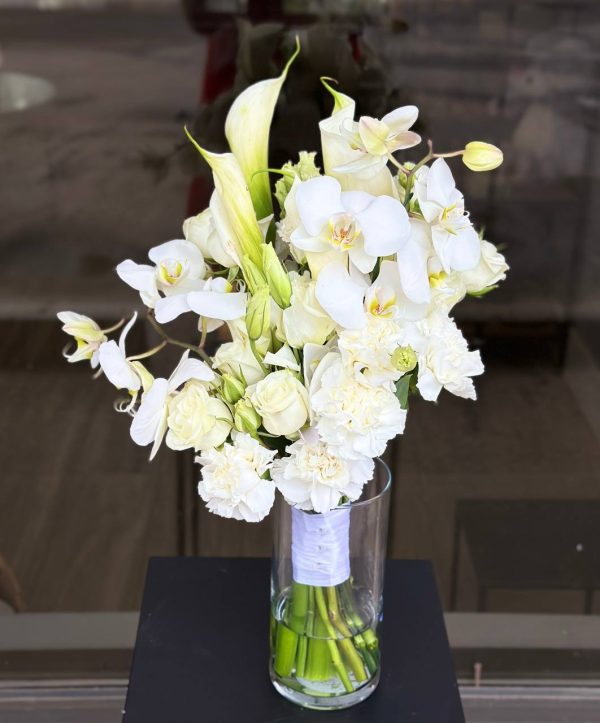 Bridal bouquet with orchids, lilies, spray roses, and carnations