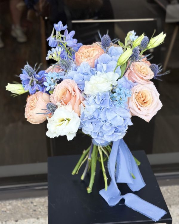 Wedding bouquet Edmonton – blue hydrangea and peach rose bridal flowers